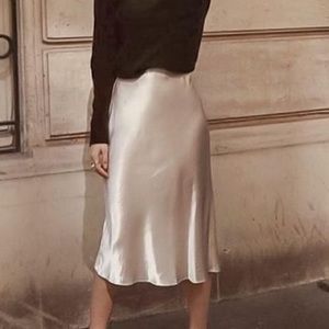 LANEWAY the label 100% silk midi skirt with slit in shell color.